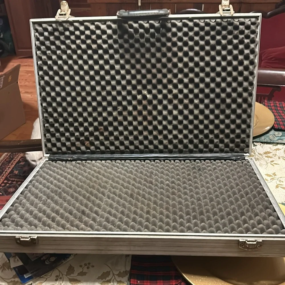 Aluminum padded case, handy for carrying anything; 24”long, 13.5”wide 4” deep